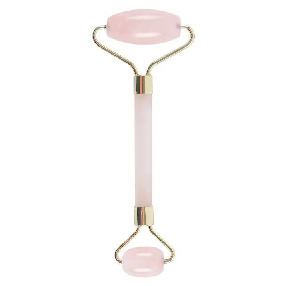 Rose quartz roller with smooth polished gemstone handles for facial massage and skincare routines