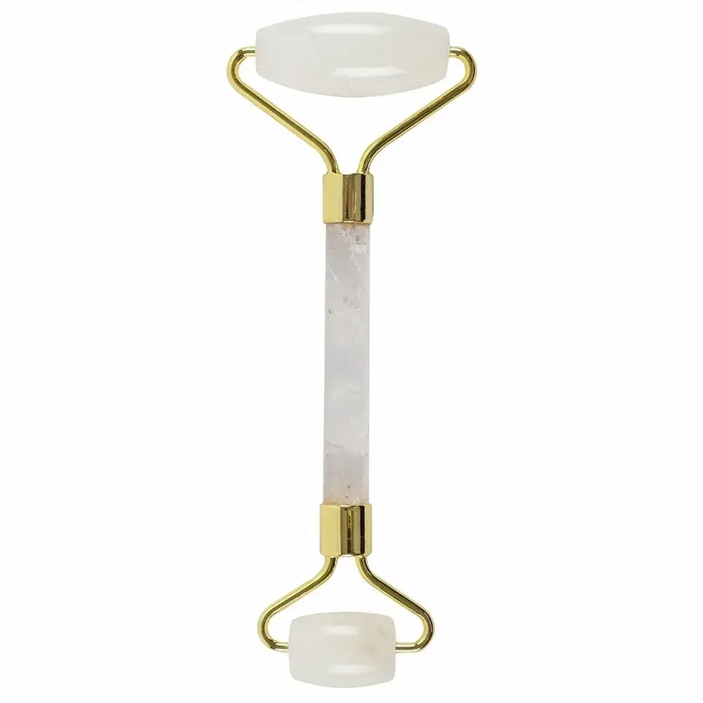 Rock quartz roller with smooth pink gemstone and wooden handle for facial massage and skincare routines