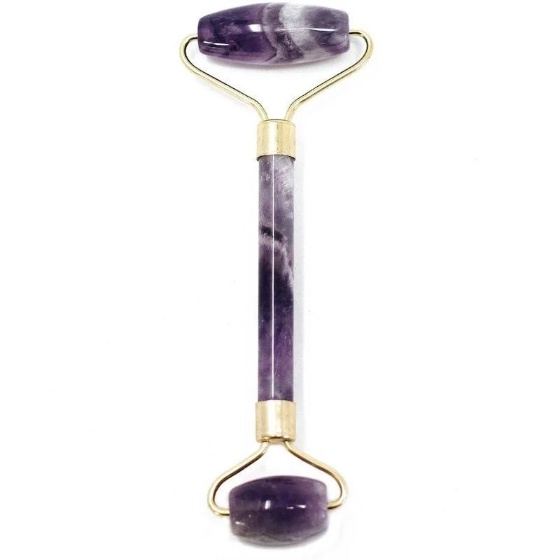 Amethyst face roller with smooth purple gemstone on a white background for skincare massage and relaxation