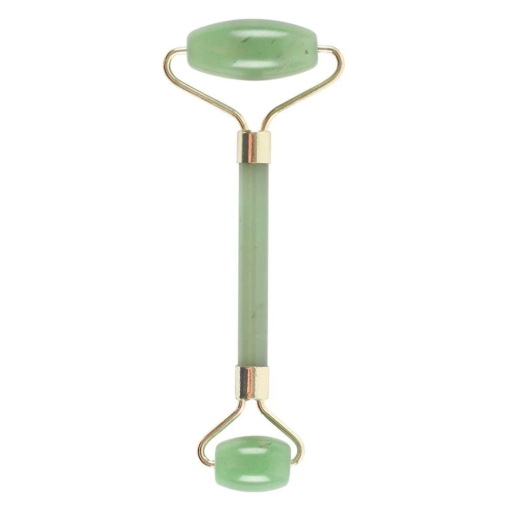 Green jade roller for face with smooth polished stones on a wooden handle against a white background
