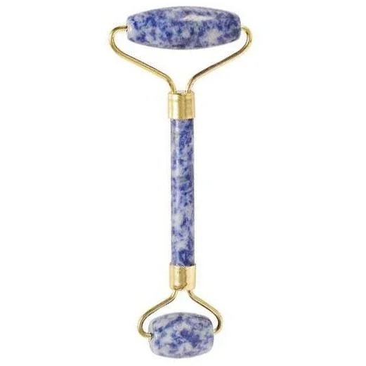 Sodalite face roller with smooth blue gemstone handles and silver metal frame for facial massage and skincare.