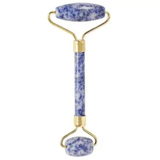Sodalite gemstone face roller with smooth blue stone rollers and wooden handle on white background