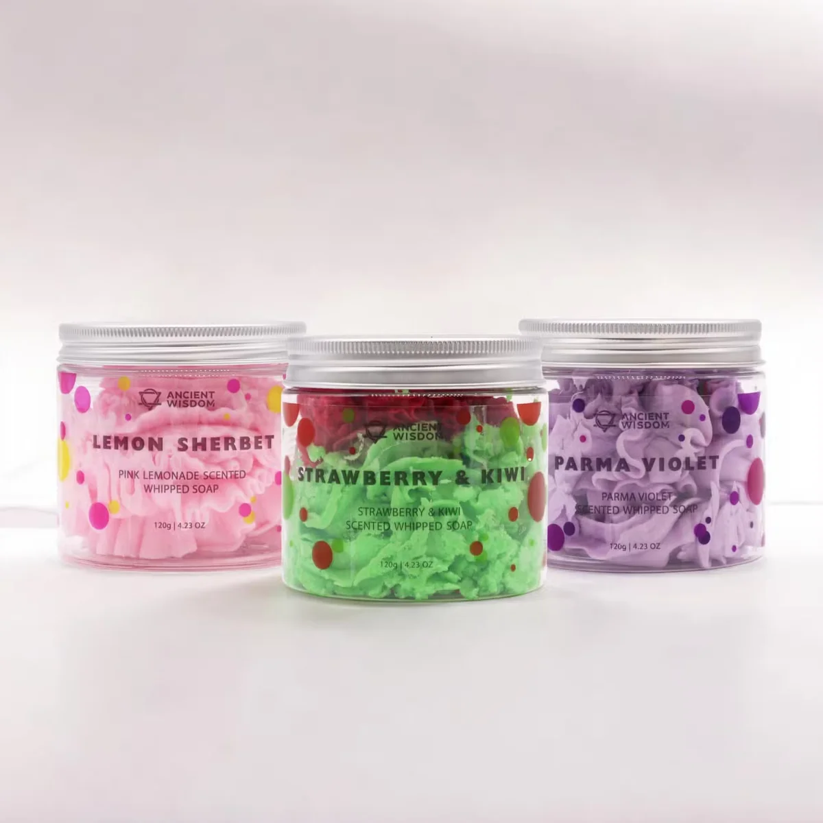 Three jars of whipped soap in pastel colors from the top selling soap set arranged on a white background