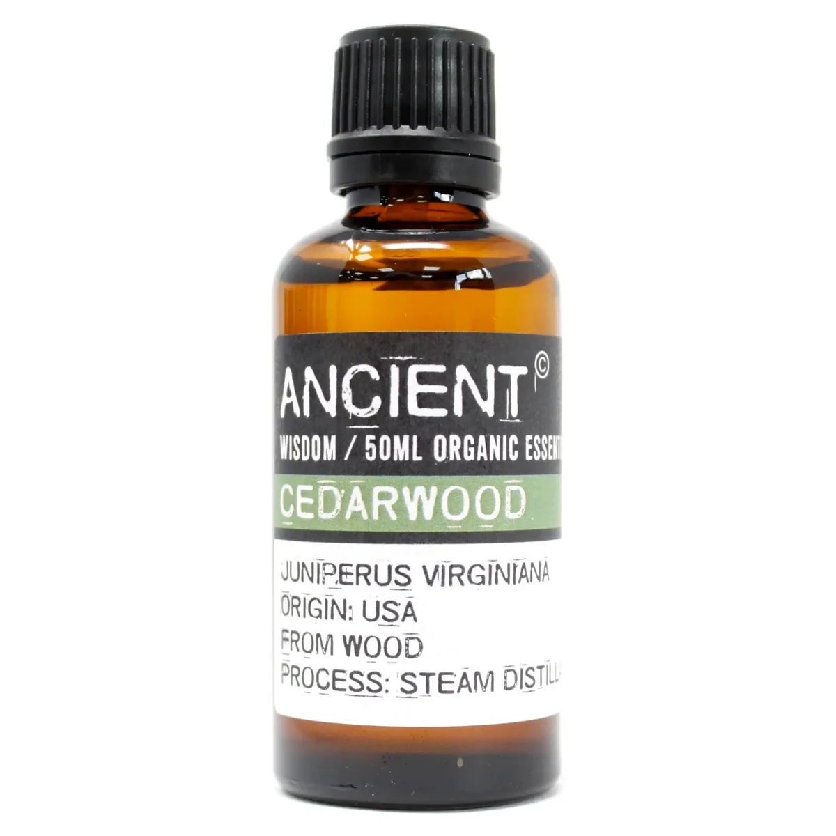 50ml amber glass bottle of cedarwood organic essential oil with wooden cap on white background