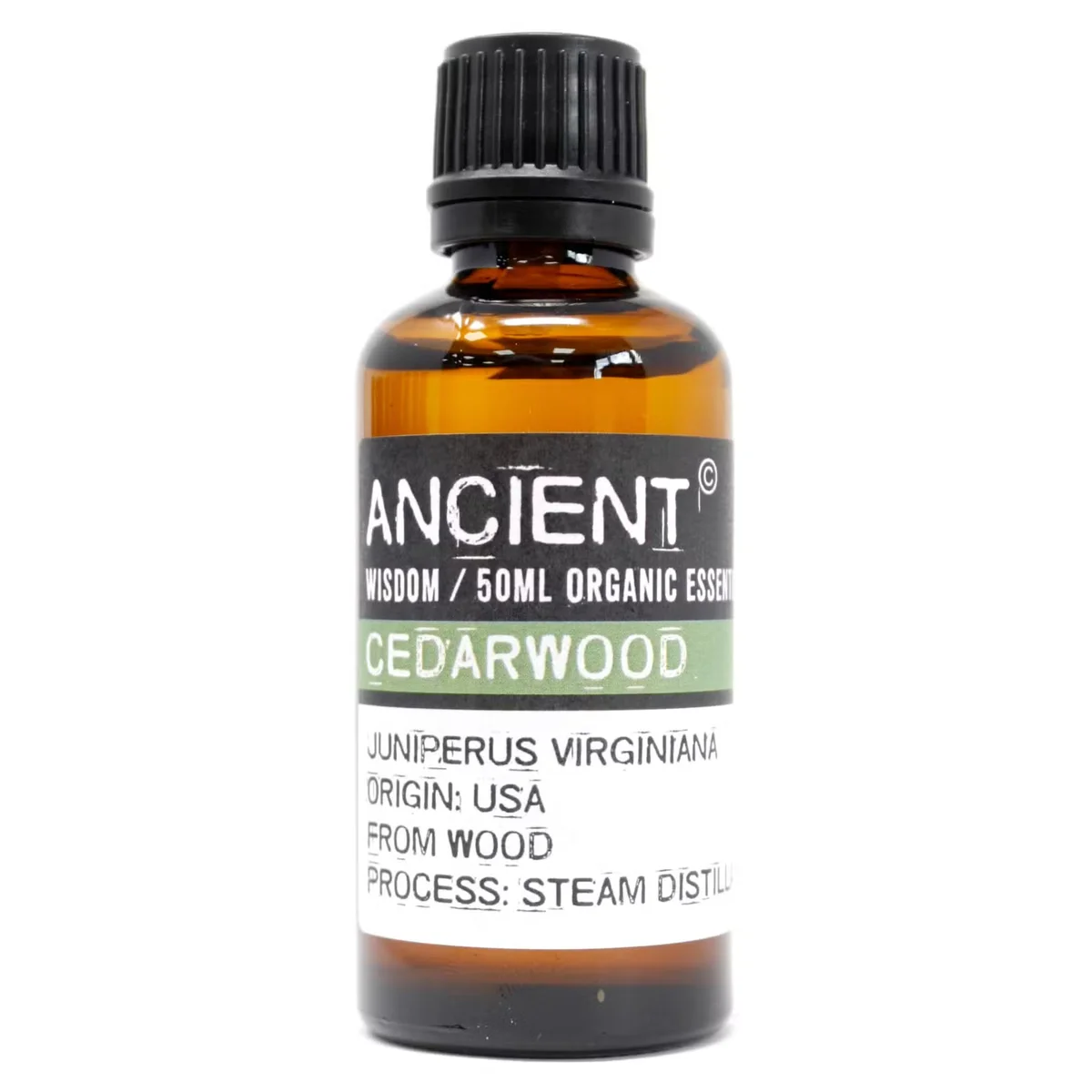 50ml bottle of Cedarwood organic aromatherapy essential oil with natural wood background