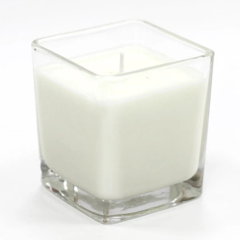 Soy wax jar candle with a white label featuring cucumber and mint fragrance.