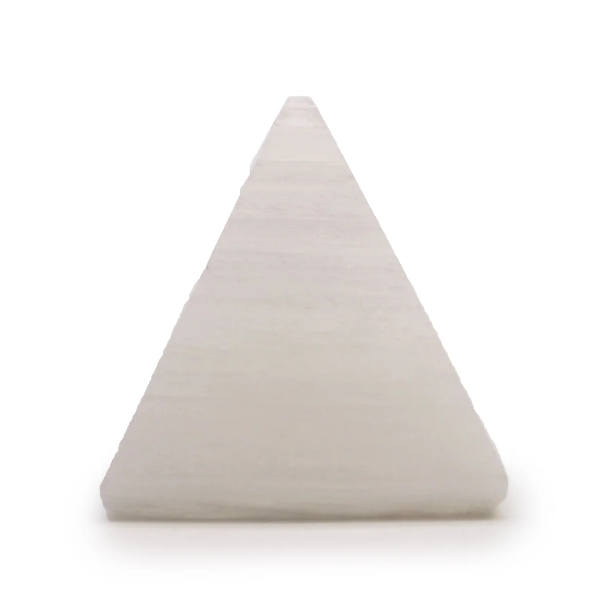 Small 5 cm selenite pyramid with smooth, translucent white crystal surfaces on a plain background
