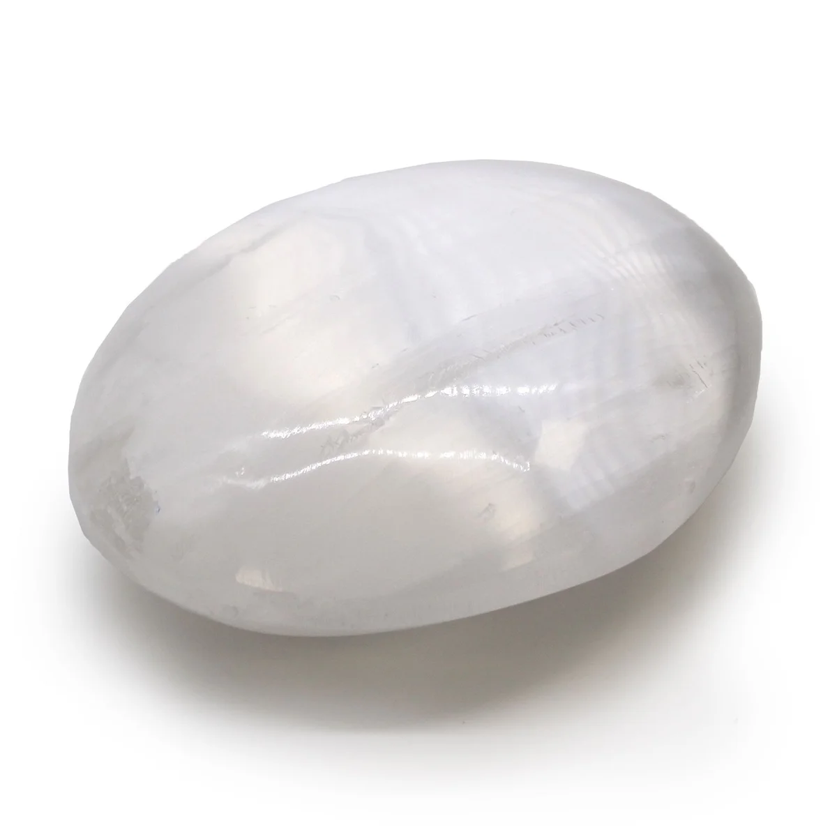 Smooth 6.5 cm selenite palm stone with white translucent bands on a plain background