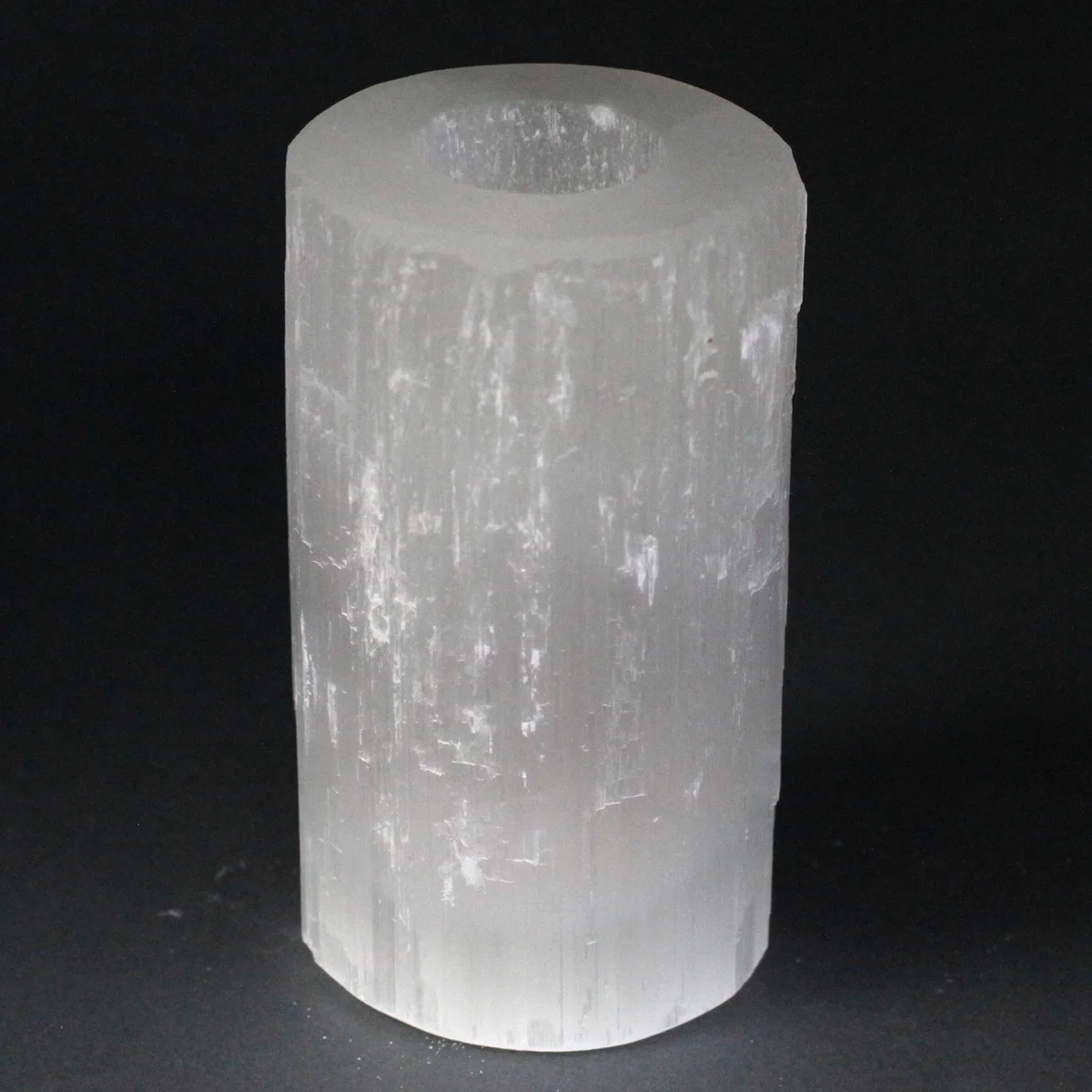 15 cm candle holder made from selenite, a clear translucent cylinder with a small base, ready for a candle