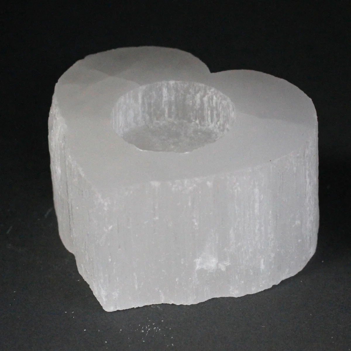Selenite heart‑shaped decorative candle holder, crystal transparent with smooth edges.