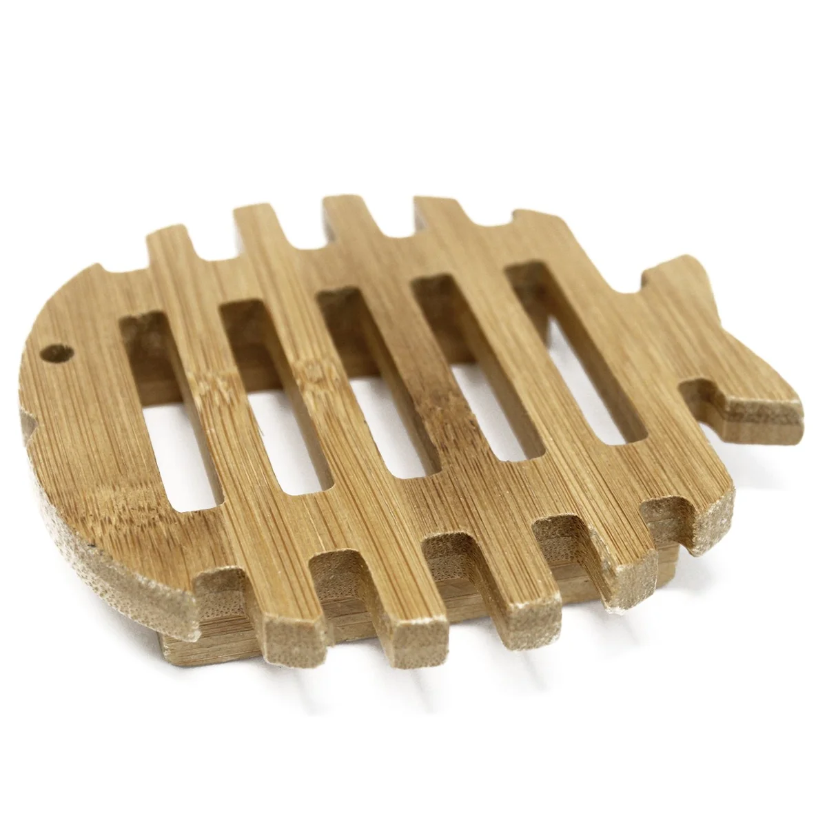 Wood soap dish shaped like a fish made from hemu wood with carved details and smooth finish