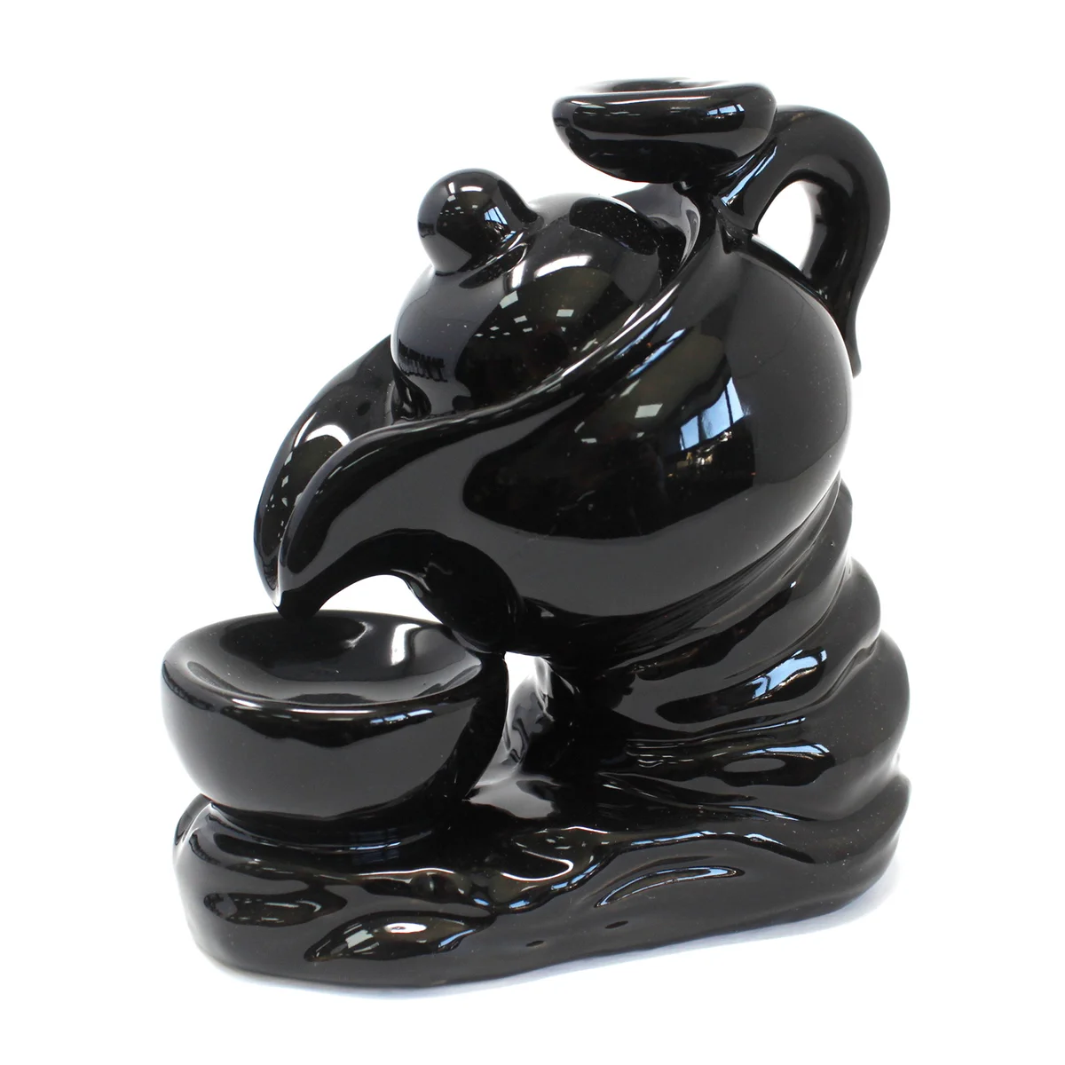 Decorative incense holder shaped like a tea pot designed for backflow incense cones, shown on a plain background
