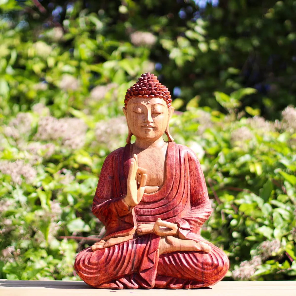 Hand carved 30cm decorative Buddha ornament showing teaching transmission pose on wooden base