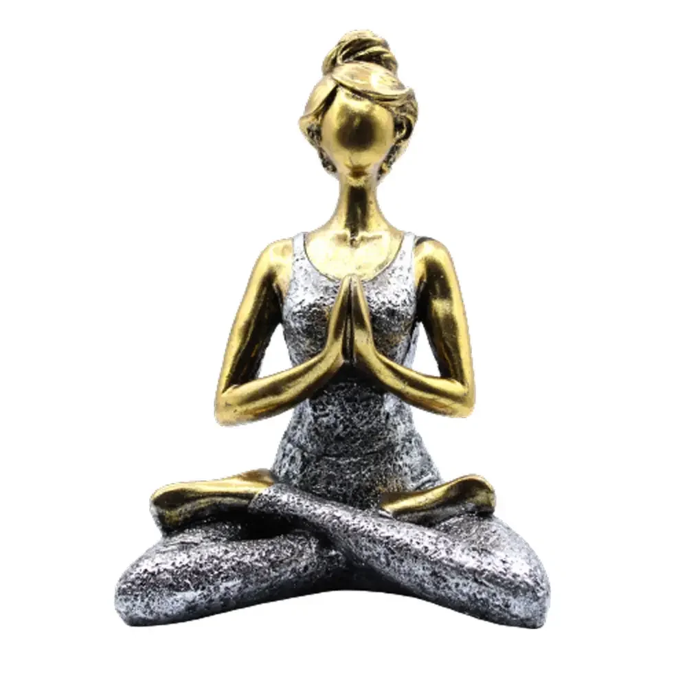 Bronze silver figure of a yoga lady in a seated pose, standing 24cm tall on a plain background