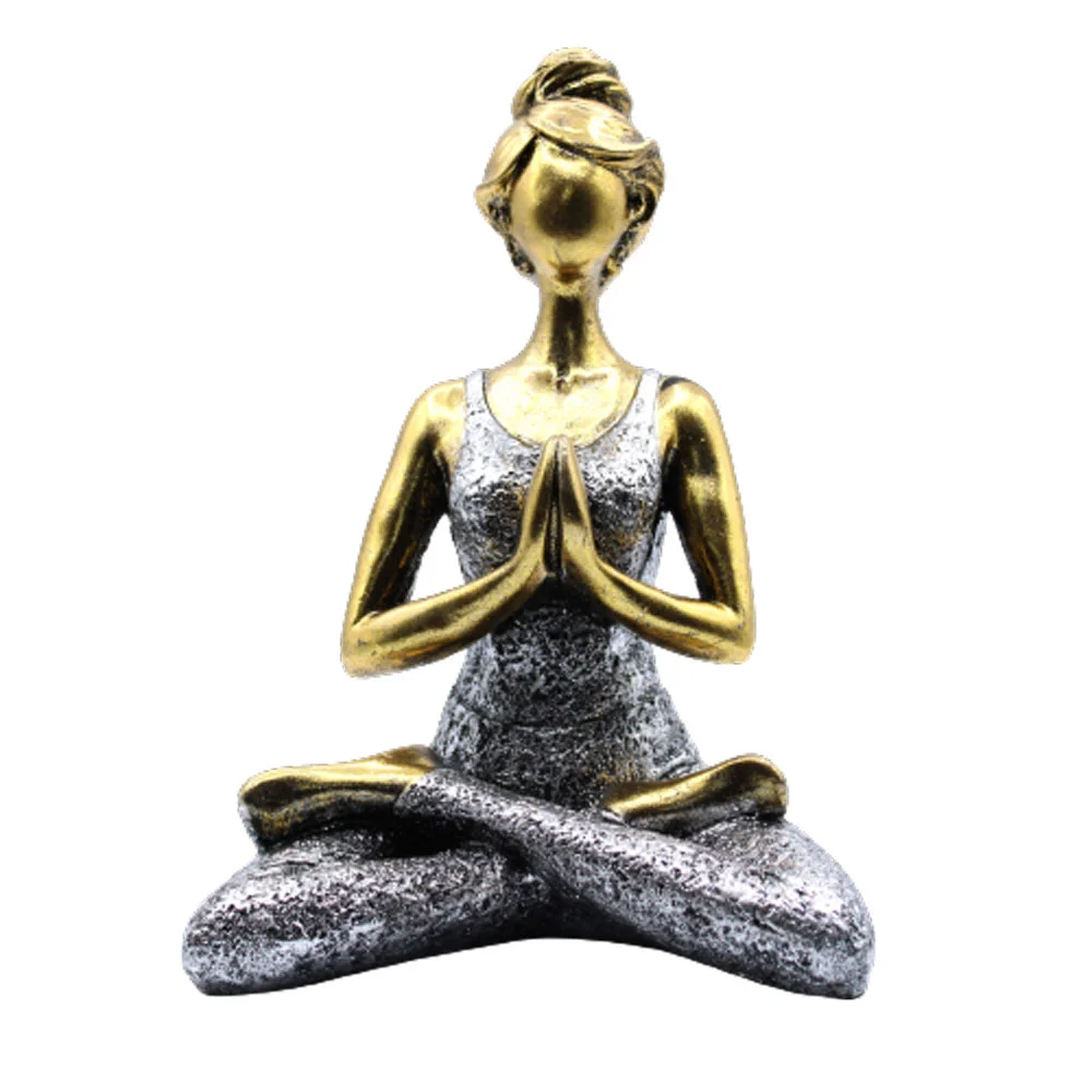 Bronze and silver 24cm yoga ornament showing a lady figure in a yoga pose on a plain background