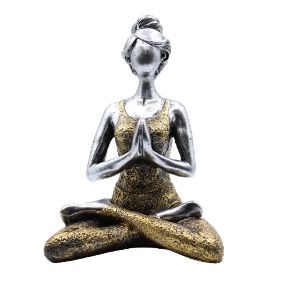 Silver and gold figurine of a yoga lady figure standing 24cm tall on a white background