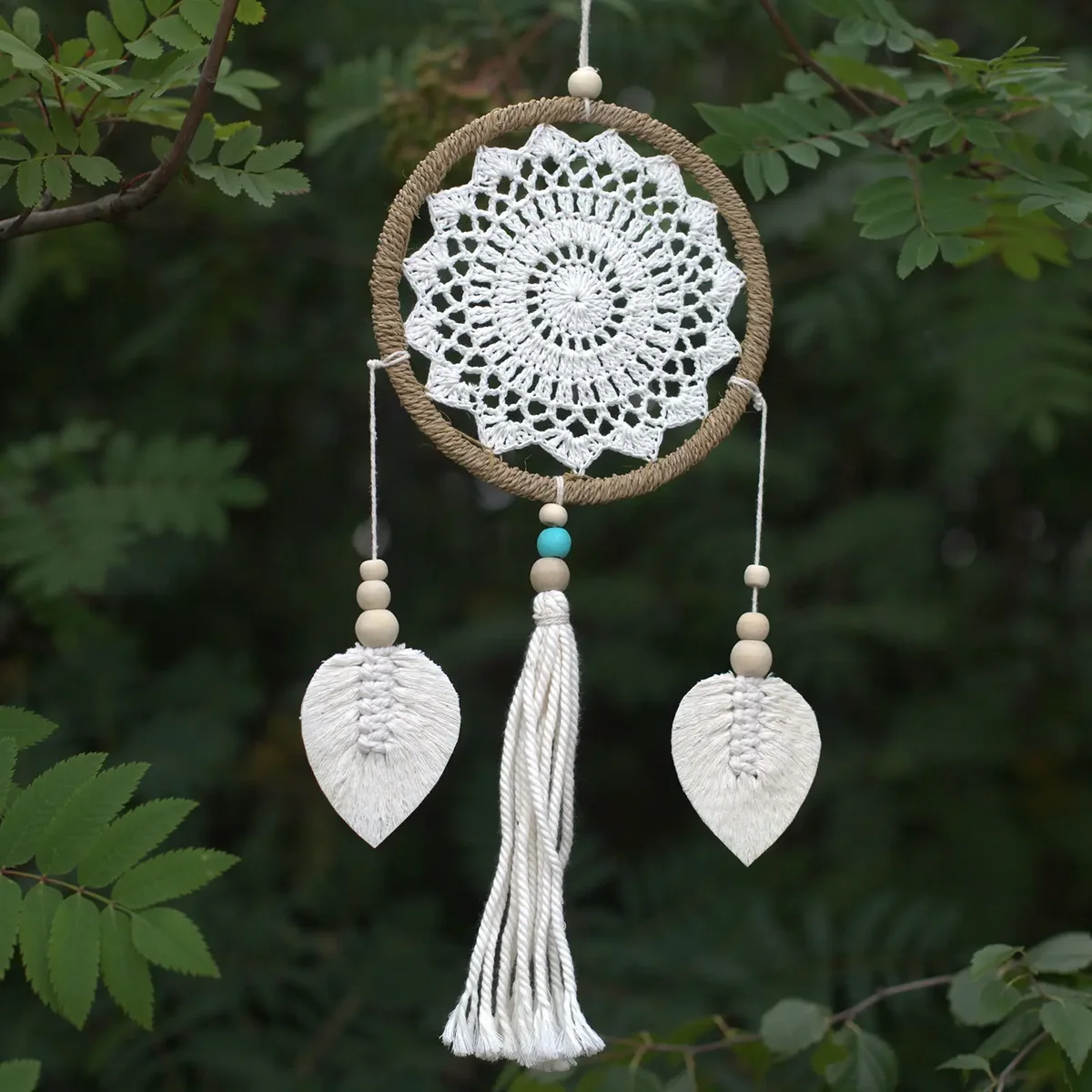 Medium natural dream catcher featuring elemental spirits design with feathers and beads hanging in a circular frame