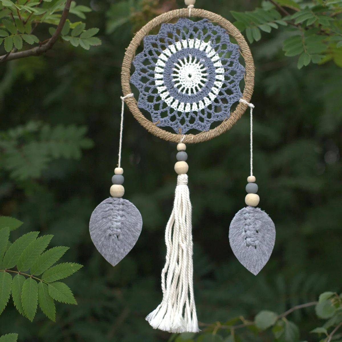 Medium grey dream catcher ornament with intricate web and feather details, representing elemental spirits theme