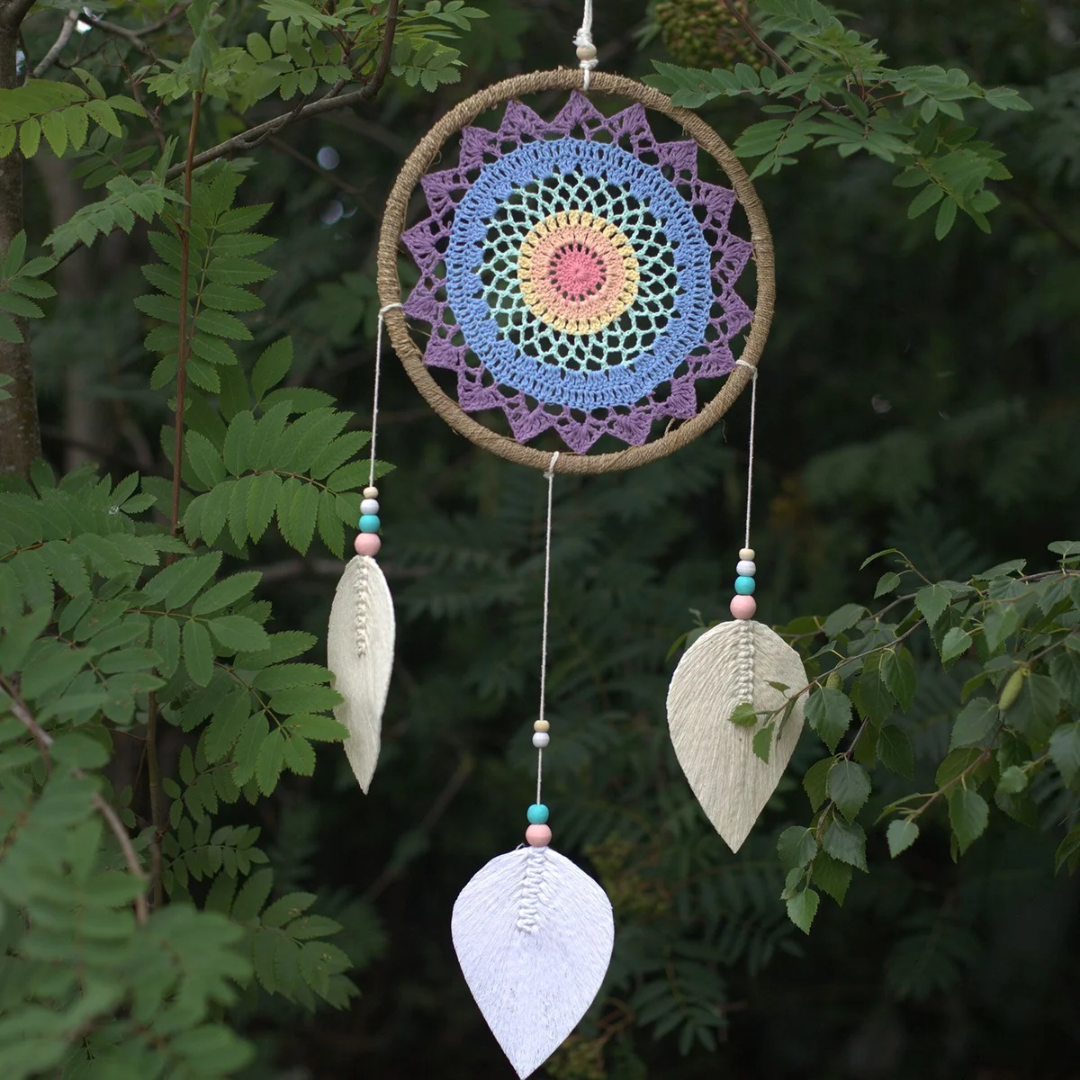 Large dream catcher featuring multiple elemental spirit designs in a decorative circular frame