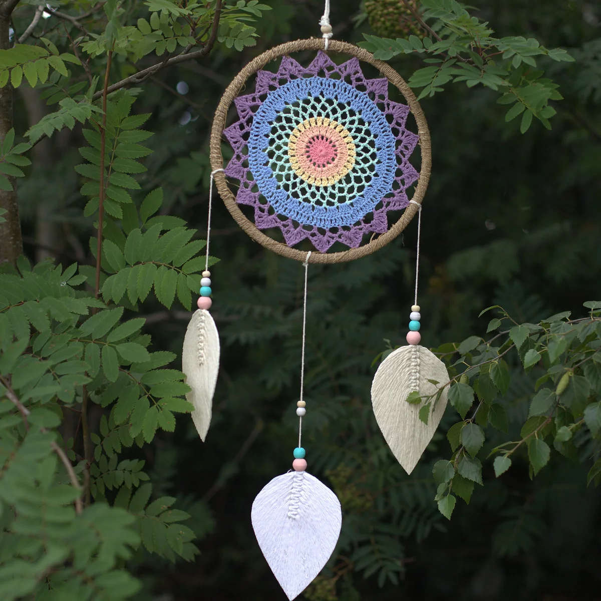 Large decorative wall art dream catcher featuring multi elemental spirits design with intricate web and feathers hanging
