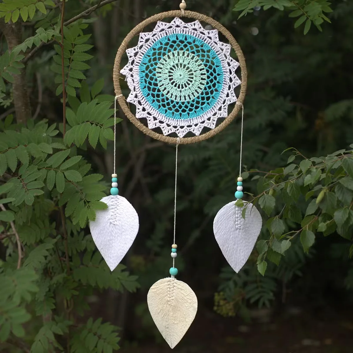 Large turquoise dream catcher with feathers and beads, bohemian wall hanging inspired by elemental spirits design
