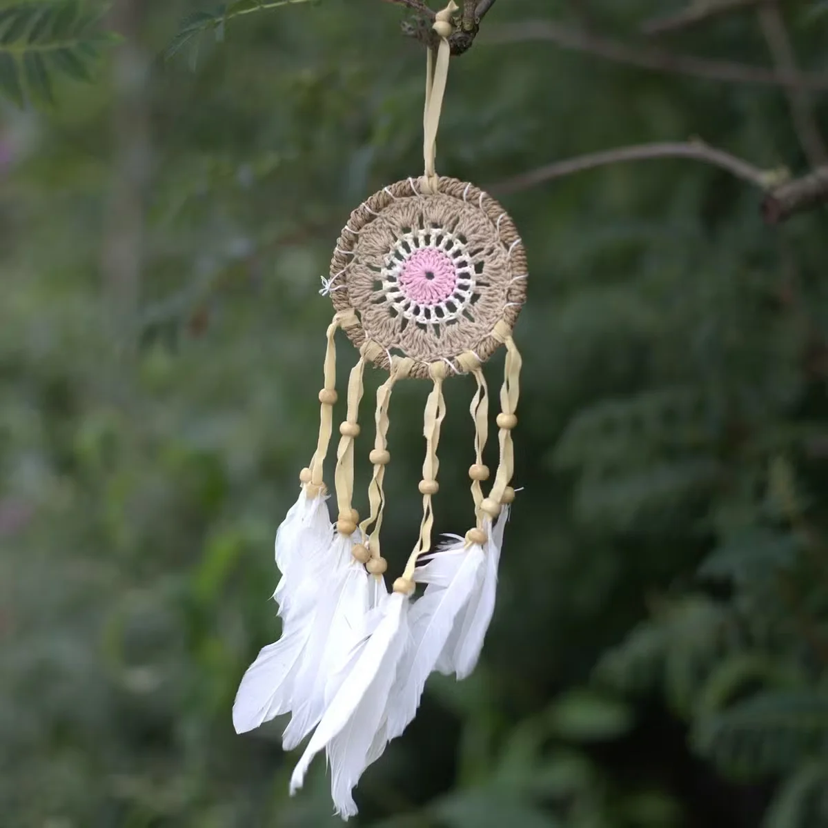 Pastel pink dream catcher with intricate macramé design, 9cm diameter, hanging decoration in soft pink tones