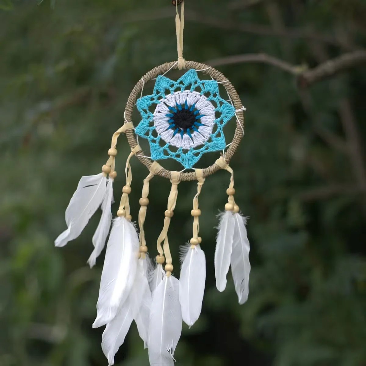Pastel blue handmade dream catcher with macramé design, 12cm diameter, soft colors, hanging decoration