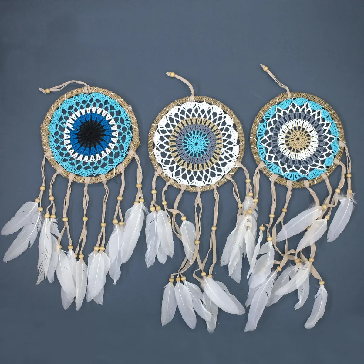 Pastel blue macramé dream catcher with intricate knots and hanging tassels, 16cm diameter, assorted colours available