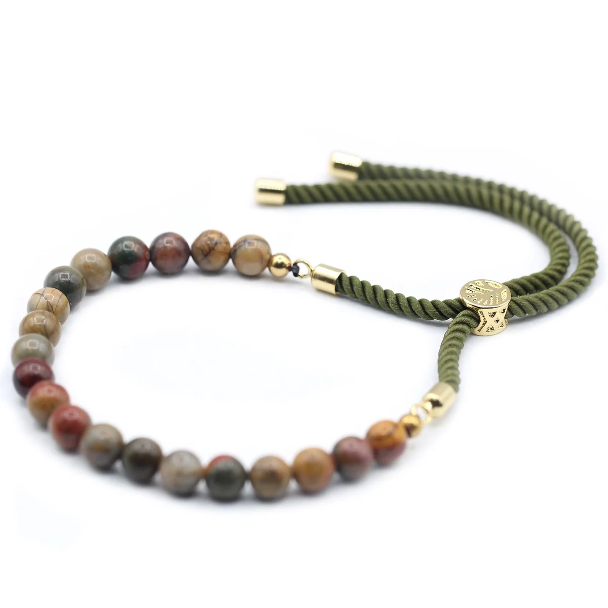 Gold gemstone bracelet featuring moss string and Picasso Jasper stone.