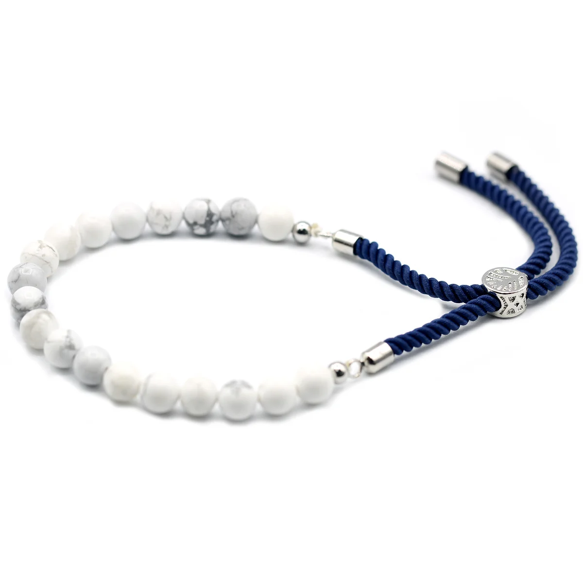 925 silver plated bracelet with white howlite gemstone on navy string bracelet against white background