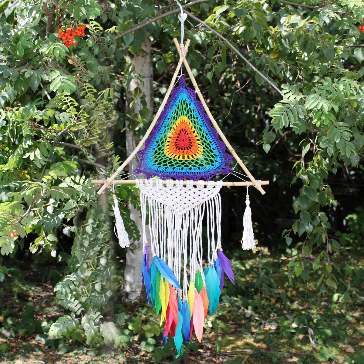 Large multi pyramid Bali dreamcatcher decor featuring intricate woven patterns and hanging feathers in neutral tones