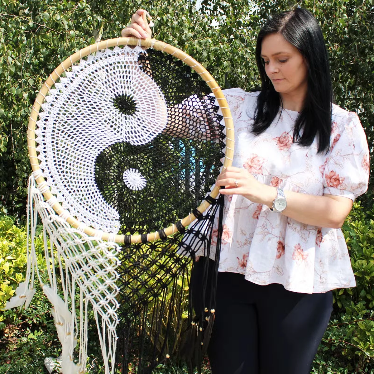 Extra large Ying Yang design large dream catcher 50cm with intricate web and hanging feathers on white background