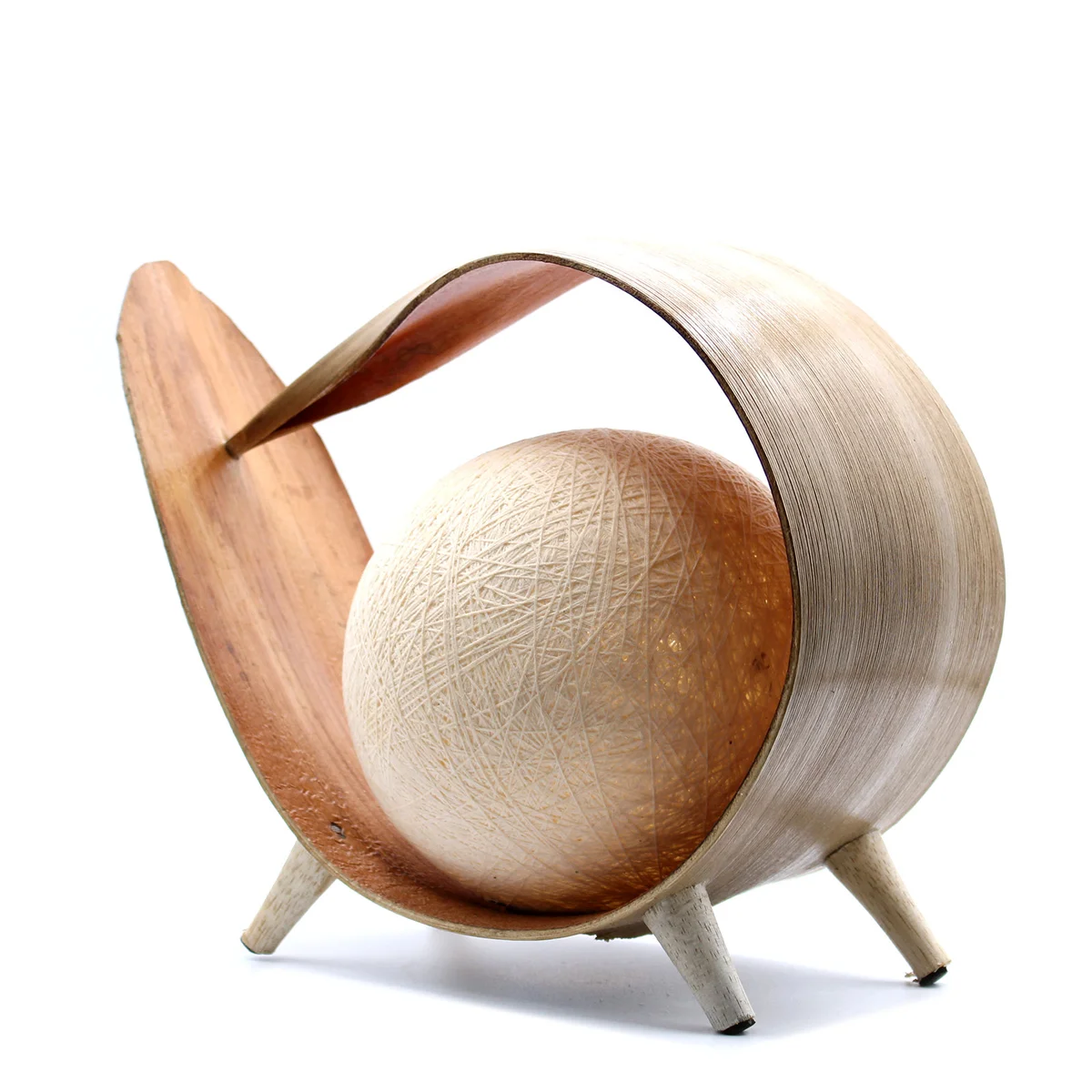 Natural decorative lamp made from a natural coconut shell with a loop design, emitting soft warm light