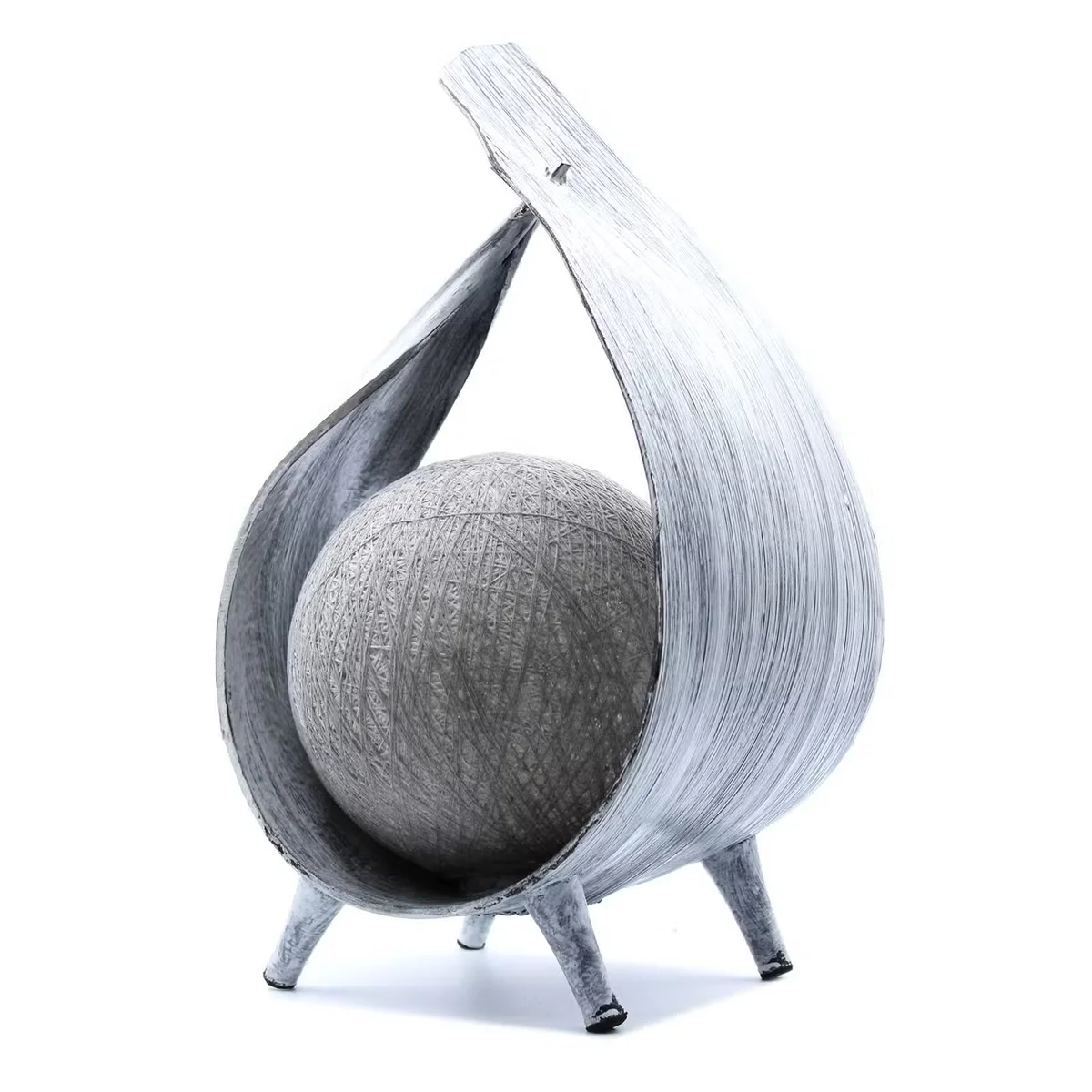 Eco friendly lamp, a natural coconut lamp wrapped in greywash, displayed on a wooden tabletop.