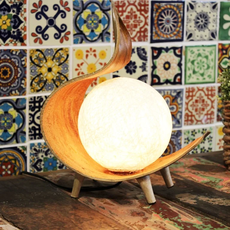 Natural coconut lamp featuring a chocolate twist design, warm light emitting from its open coconut body