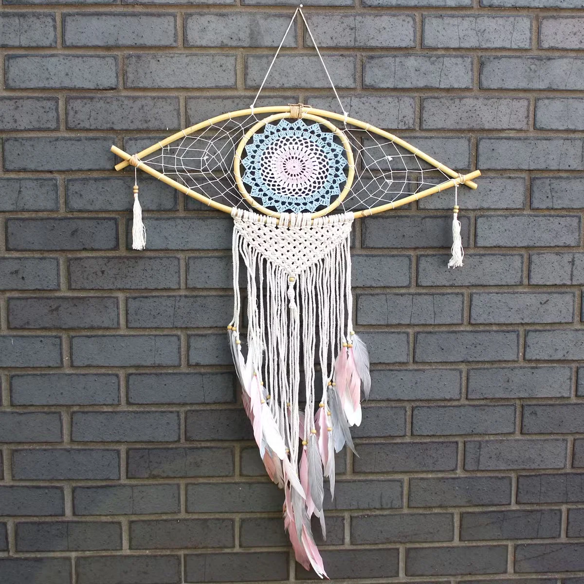 Large macrame wall hanging decor with blue, white, and pink dream catcher featuring an eye design
