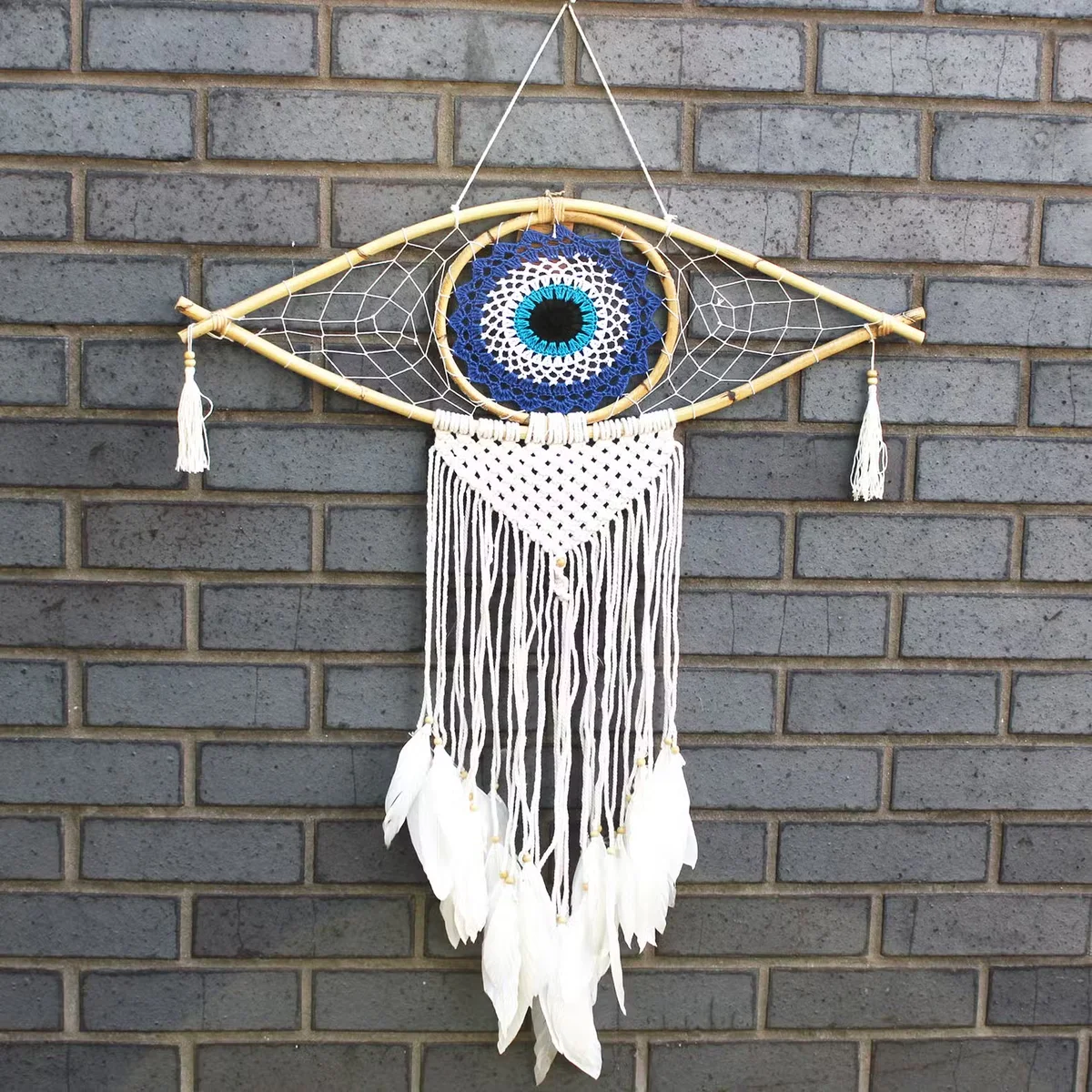 Large macrame dream catcher with evil eye decor in blue, white and black, hanging décor.