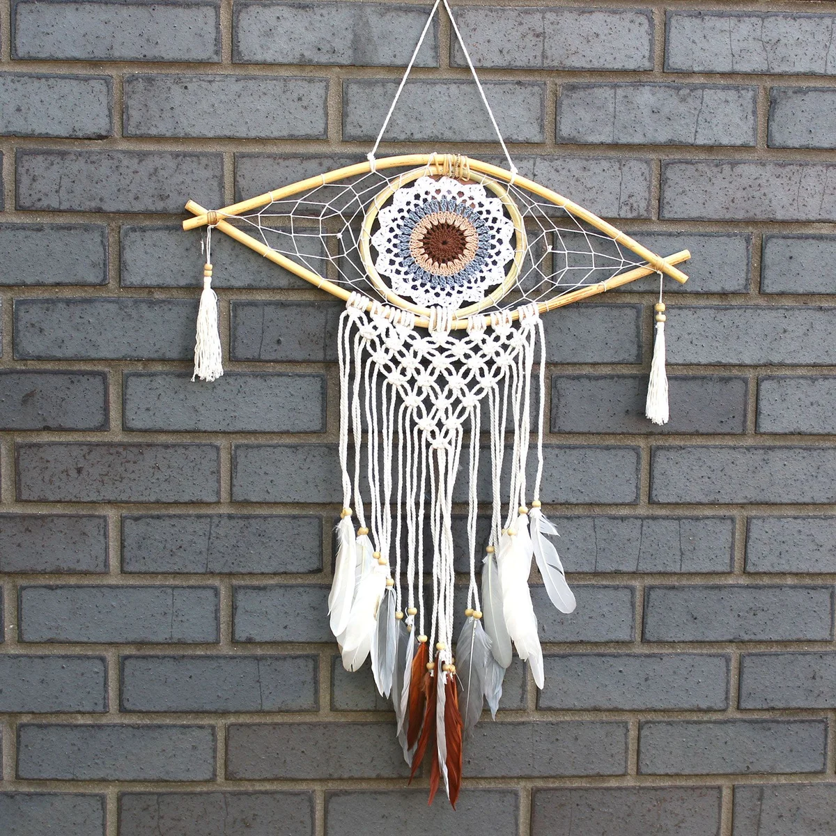 Medium macrame protection dream catcher featuring an Evil Eye, woven in white, grey and brown hues