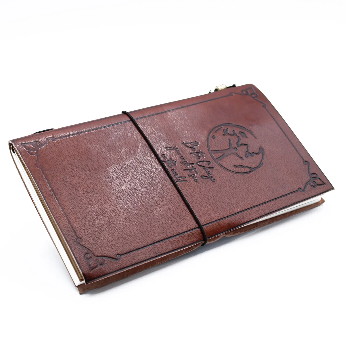 Brown leather journal with an embossed cover, open to a clean page, highlighted by a pen resting beside it