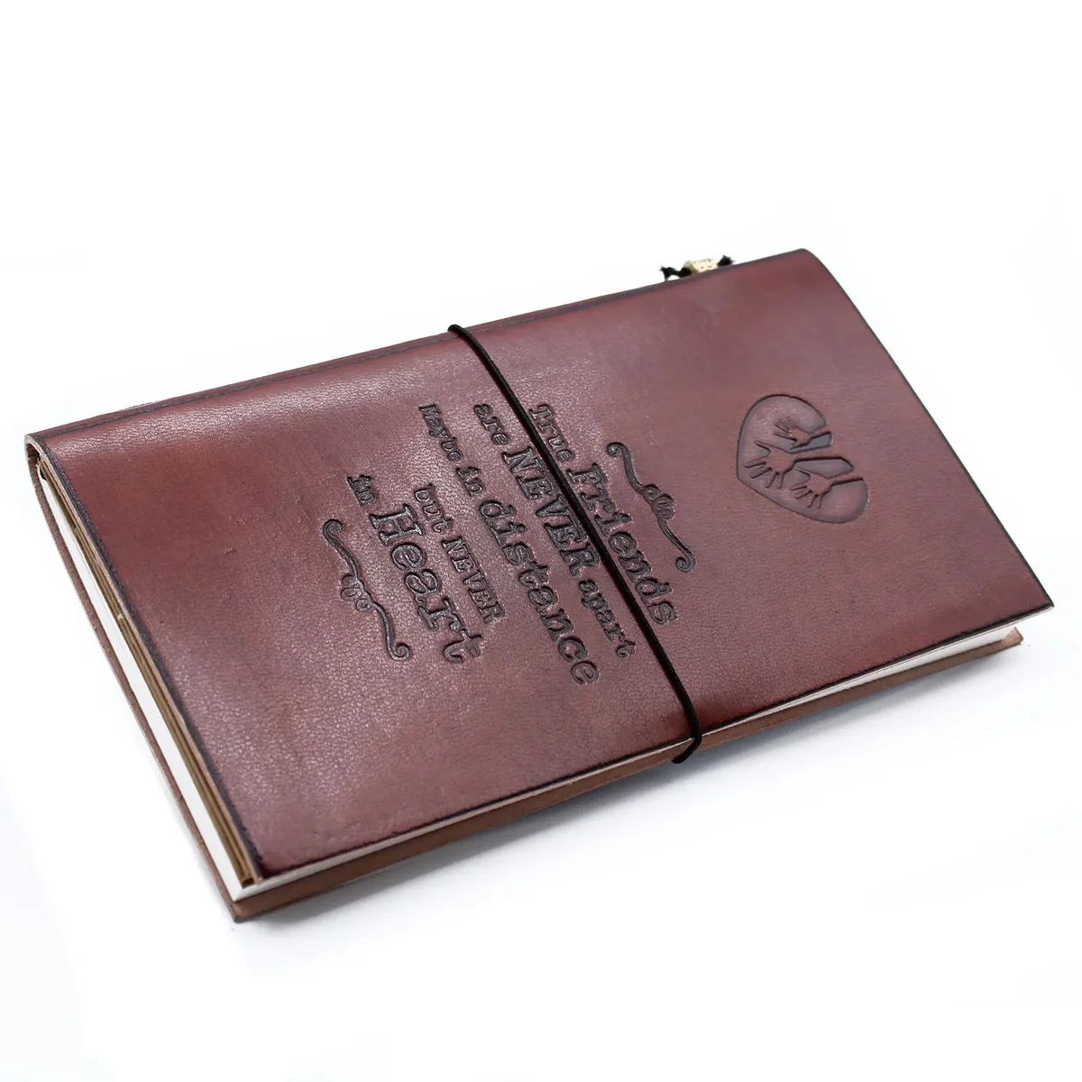Brown leather journal with soft cover and leather binding, open to cream page layout, showcasing its handmade quality.