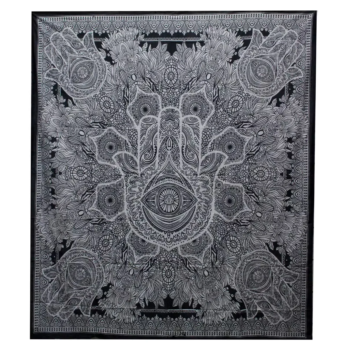 Black and white double cotton bedspread paired with a hamsa wall hanging, showcasing a minimalist styled bedding set.