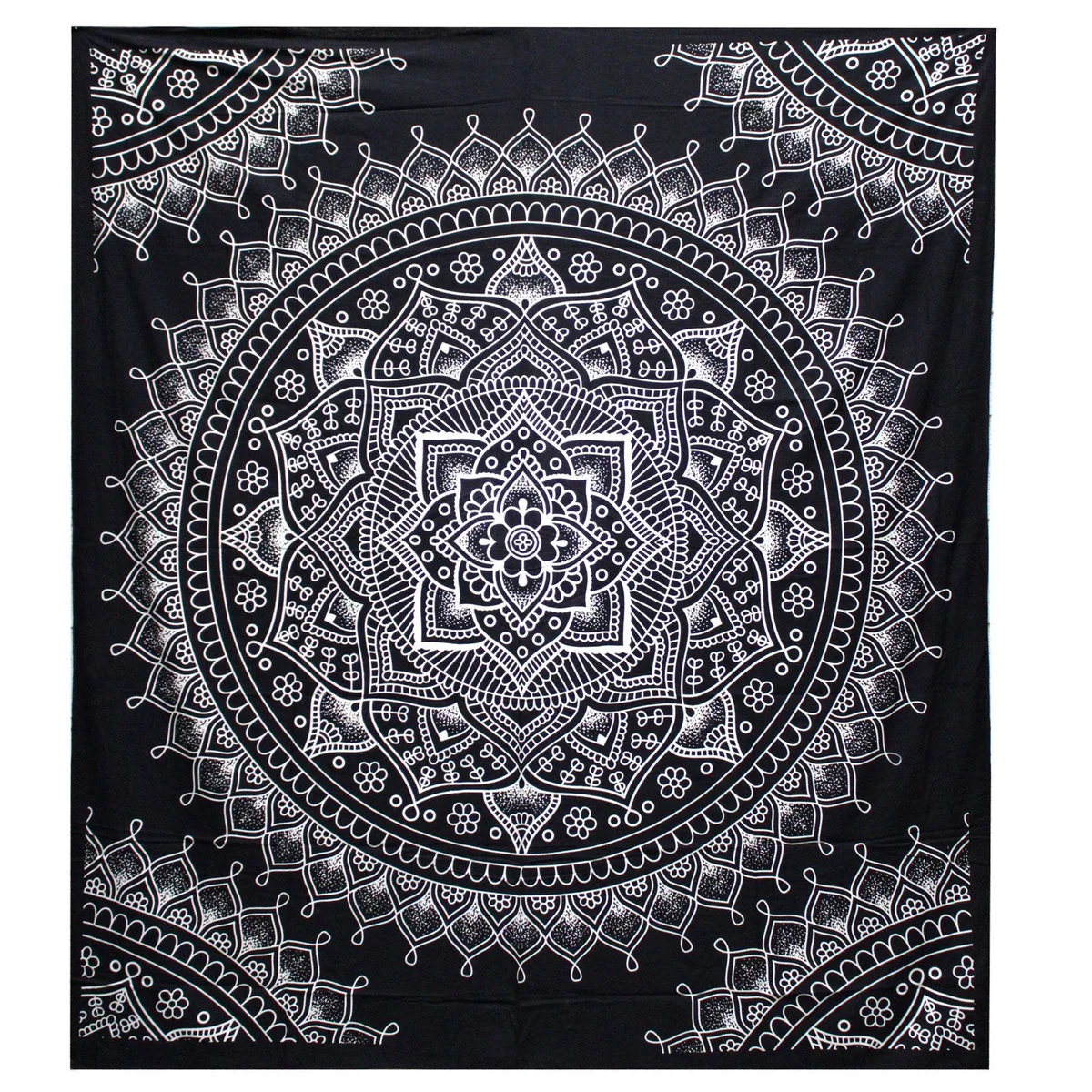 Black and white cotton bedspread double with lotus flower pattern and matching wall hanging on a bed.