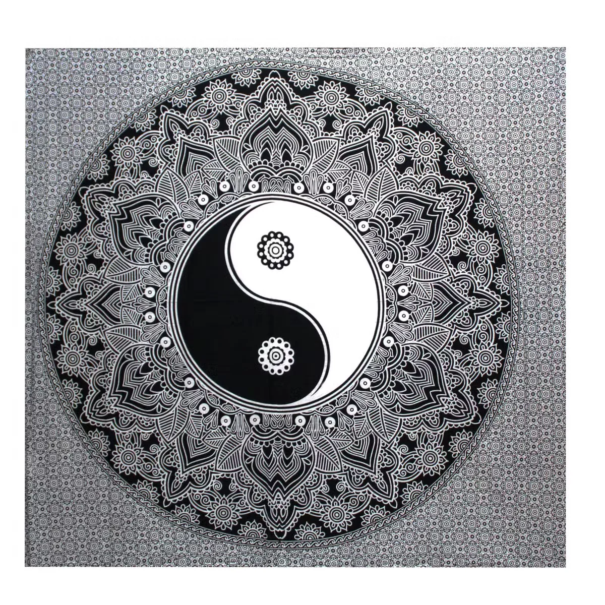 Black and white bedspread adorned with Ying yang design, paired with a matching wall hanging.