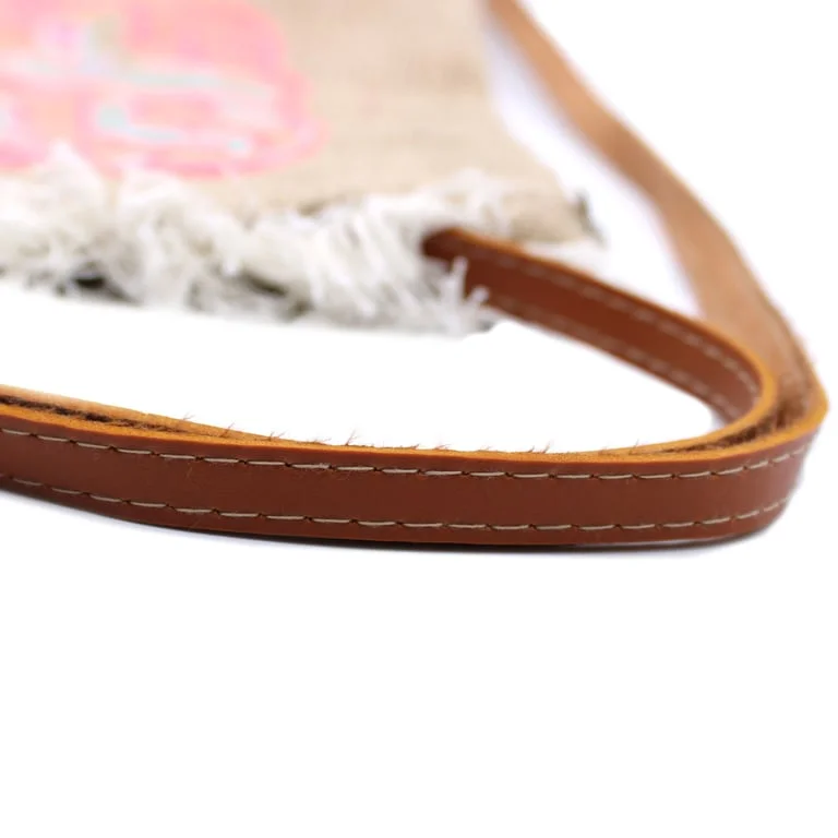 Fringe‑trimmed summer embroidery bag with colourful summer pattern, displayed on a neutral background