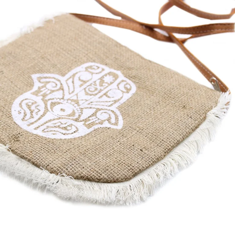 Hamsa print handbag with fringe detailing, displayed on a white backdrop