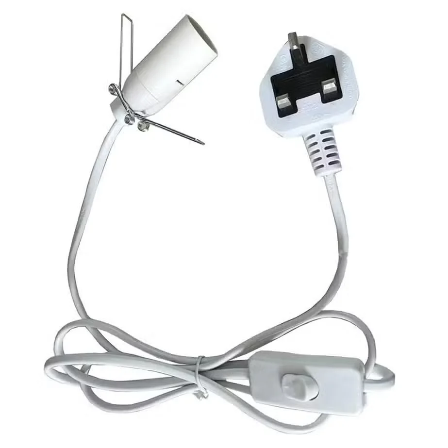 White fitting cable for UK sockets coiled neatly with visible plug and connector ends on a white background