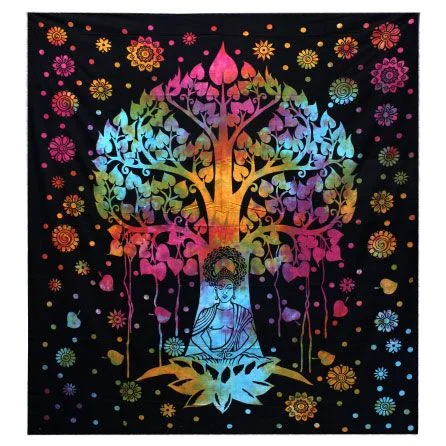 Cotton bedspread draped over a bedside table with a Bodhi tree‑themed wall hanging above