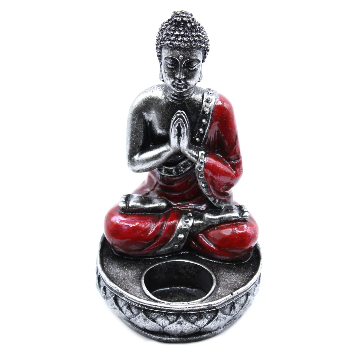 Red medium Buddha candle holder on a table with a lit candle