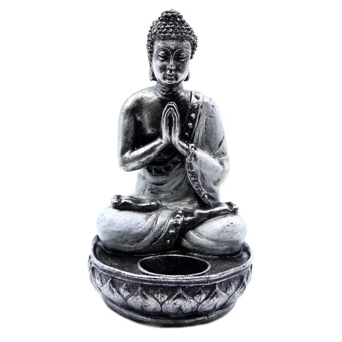 Buddha design white medium candle holder on a wooden tabletop, displaying simple clean lines and subtle shading.