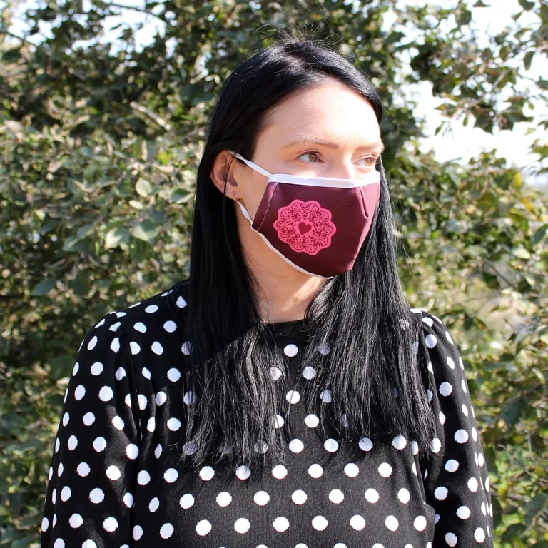 Adult face mask with a red mandala heart pattern